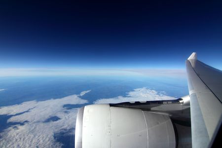 Wing of the plane on a background of skyの写真素材