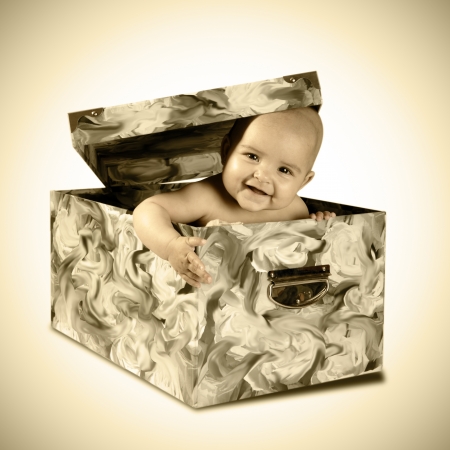a cute baby inside a present boxの写真素材