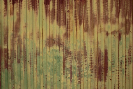 a rusty and old green metal wallの写真素材