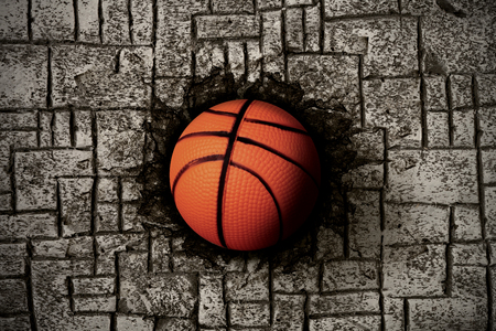 basketball embedded in a stone floorの写真素材