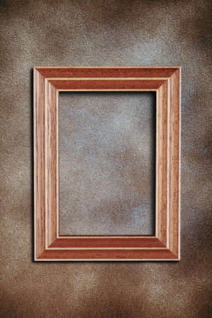 empty frame over a textured wallの写真素材