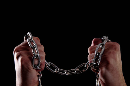 human hands taking a chain