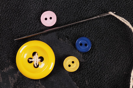 vintage image with some buttons and threadの写真素材