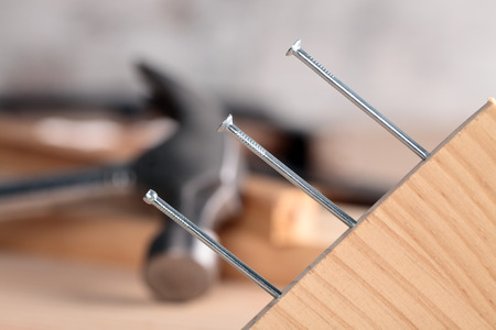 detail of a nail and a hammerの写真素材