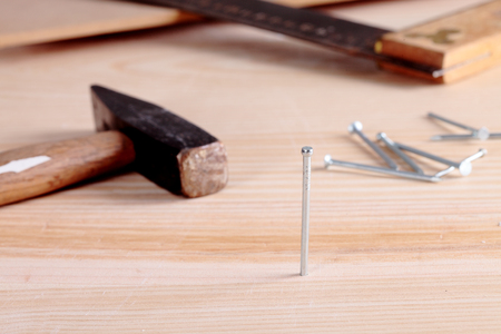 detail of a nail and a hammerの写真素材