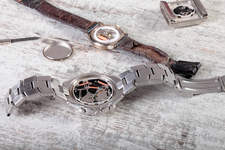 repairing some old and broken clocksの写真素材