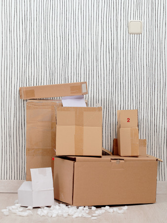 pile of open boxes on a apartment roomの写真素材