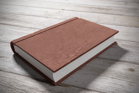 3d rendering  of an old book over a woodの写真素材