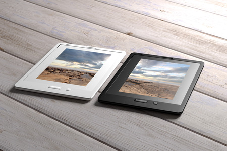 3d rendering of tablet on a wood tableの写真素材