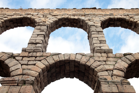 an old stone aqueduct in Segovia, Spainの写真素材