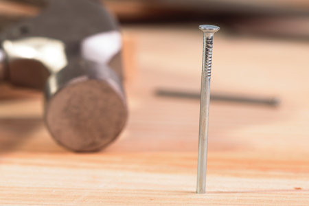detail of a nail and a hammerの写真素材