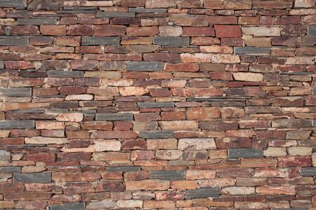 detail of the texture of an old stone brick wall