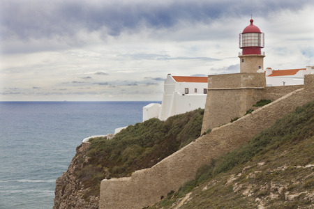 Lighthouse in the sea, Algarve, Portugalの写真素材