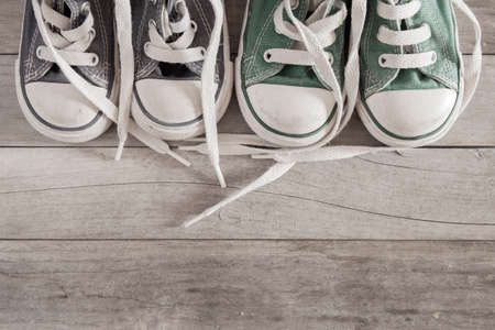 Picture of a child shoe on a wooden floor