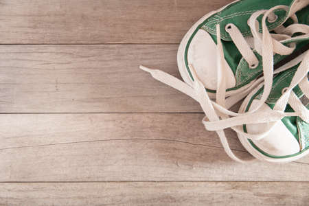 Picture of a child shoe on a wooden floor
