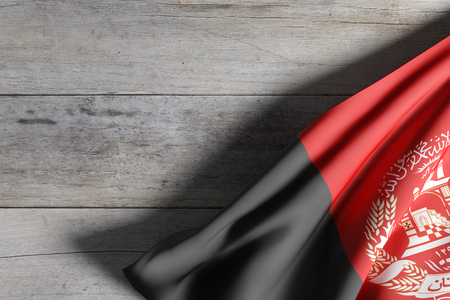 3d rendering of an Afghanistan flag waving on a wooden surfaceの写真素材