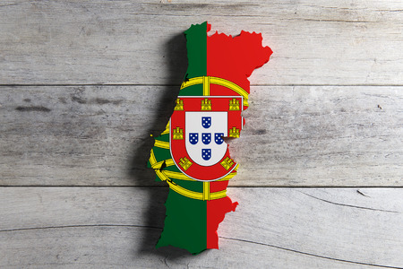 3d rendering of Portugal map and flag on wooden background.の写真素材