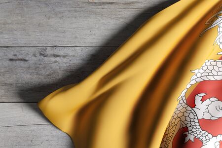 3d rendering of Kingdom of Bhutan flag on a wooden backgroundの写真素材