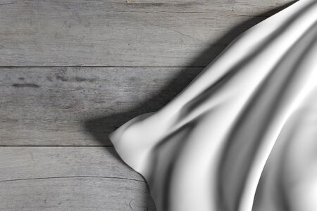 3d rendering of conceptual shot of a sheet of white silken cloth coming across a wooden floorの写真素材