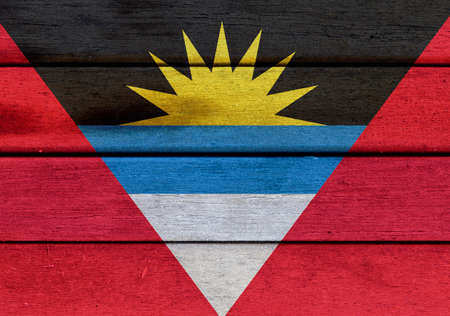 Illustration of Antigua and Barbuda flag over a wooden textured surface