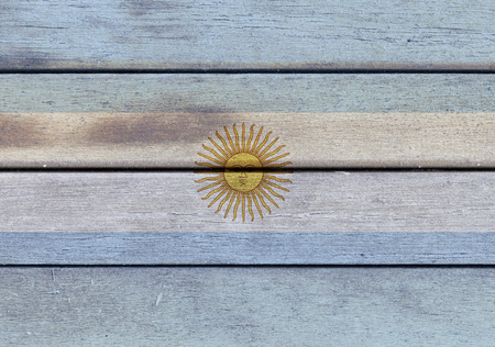 Illustration of Argentina flag over a wooden textured surfaceの写真素材