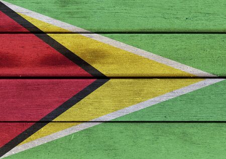 Illustration of Republic of Guyana flag over a wooden textured surfaceの写真素材