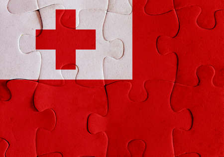 Illustration of a flag of Kingdom of Tonga over some puzzle pieces. Its a JPG image.の写真素材