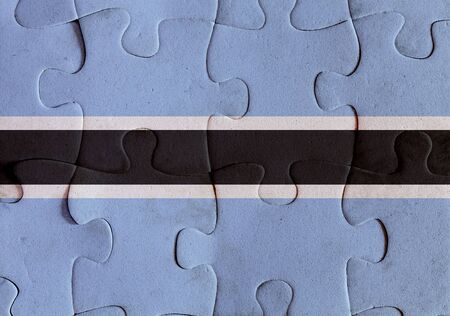 Illustration of a flag of Botswana over some puzzle pieces. Its a JPG image.の写真素材
