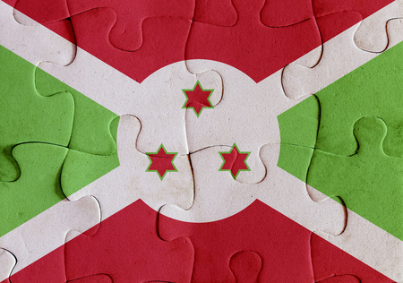 Illustration of a flag of Burundi over some puzzle pieces. Its a JPG image.の写真素材