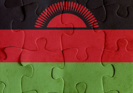 Illustration of a flag of Malawi over some puzzle pieces. Its a JPG image.の写真素材