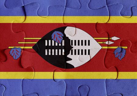 Illustration of a flag of Kingdom of Swaziland over some puzzle pieces. Its a JPG image.の写真素材