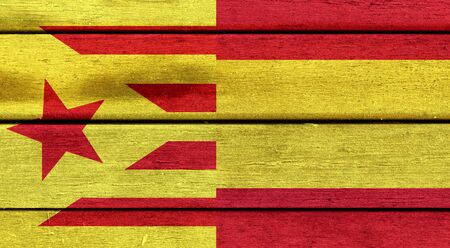 Illustration of a mixed of a Spain and Catalonia flag on wooden surfaceの写真素材