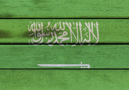Illustration of Kingdom of Saudi Arabia flag over a wood surfaceの写真素材