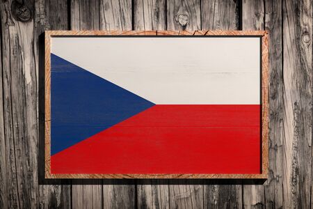 3d rendering of Czech Republic flag on a wooden frame over a planks wallの写真素材