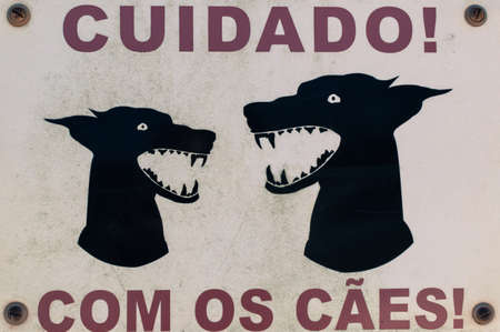 Dangerous dog sign posted on a grate of a house near Sagres in the Algarve in Portugal. This photo was taken in June 2016 near a very nice ceramic shop.の写真素材