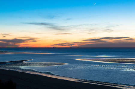 Sunset in Sanlúcar de Barrameda in April 2016 from the Espiritu Santo neighborhood on the beach of La Jara.の写真素材