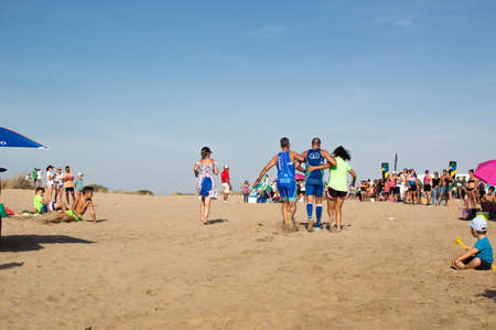 Athletes finish running this extreme triathlon on the beach of the Do? ? ana National Park. In theのeditorial素材