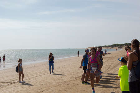 Athletes finish running this extreme triathlon on the beach of the DoÃ ± ana National Park. In theのeditorial素材
