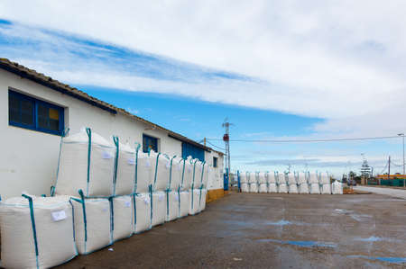 Sacks stacked one on top of the other in the salt flats of Sanlucar de Barrameda, Spain, at the mouth of the Guadalquivir river. A spectacular saltwork of great scenic and interpretive value and that constitutes a privileged enclave in front of the Coto de DoÃ±ana.の写真素材