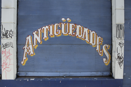 Old Steel curtain with text in spanish "Antiques", Valparaiso, chileの写真素材