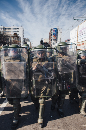 Valparaiso, Chile - June 01, 2017: Chilean riot police repress Protestants during a march on the...