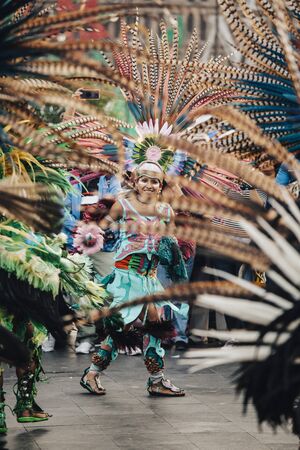 Mexico City, Mexico - December 22, 2017: Aztec dancers dancing in the Zocalo in Mexico City, DF,...