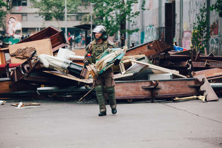 SANTIAGO, CHILE-NOVEMBER 8, 2019 - Riot police clear barricades in the church