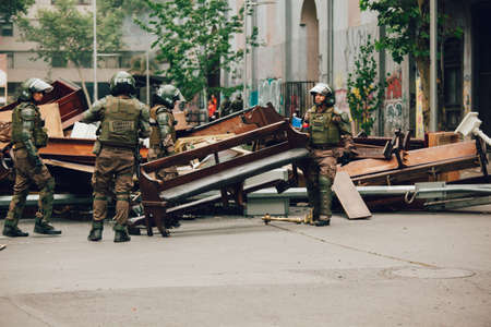 SANTIAGO, CHILE-NOVEMBER 8, 2019 - Riot police clear barricades in the church