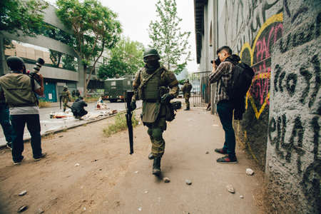 SANTIAGO, CHILE-NOVEMBER 8, 2019 - Use of anti-riot shotgun by police to disperse protesters who...
