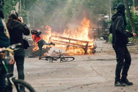 SANTIAGO, CHILE-NOVEMBER 8, 2019 - Protesters barricade with looted furniture from the