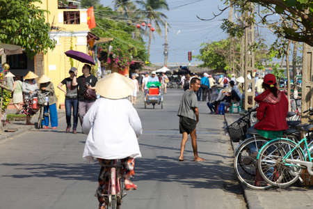 People on the street of Hoi An, Vietnamのeditorial素材