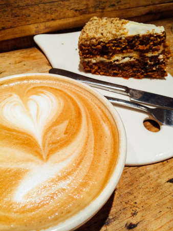 Cup of coffee with carrot cake