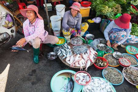 NHA TRANG, VIETNAM - JANUARY 20: Women are selling seafood at the wet market on January 20, 2016 in Nha Trang, Vietnam.のeditorial素材