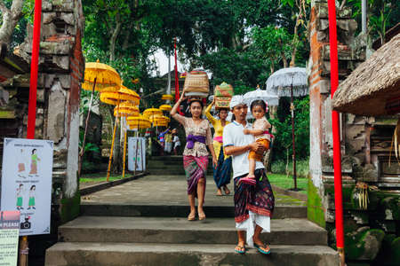 UBUD, INDONESIA - MARCH 2: Family walks down the stairs during the celebration before Nyepi (Balinese Day of Silence) on March 2, 2016 in Ubud, Indonesia.のeditorial素材